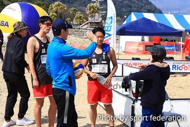 Photograph of a Sign language interpreter interpreting and communicating to the athletes.