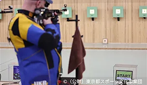 Photograph of a shooting athlete.