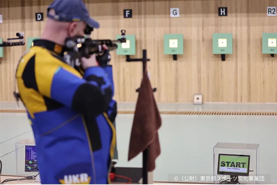 Photograph of a shooting athlete.