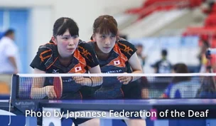 Photograph of table tennis players.