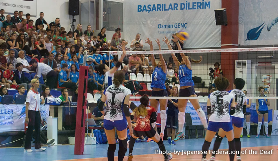 Photograph of volleyball players.