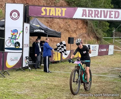 Photograph of athletes at the finish line.